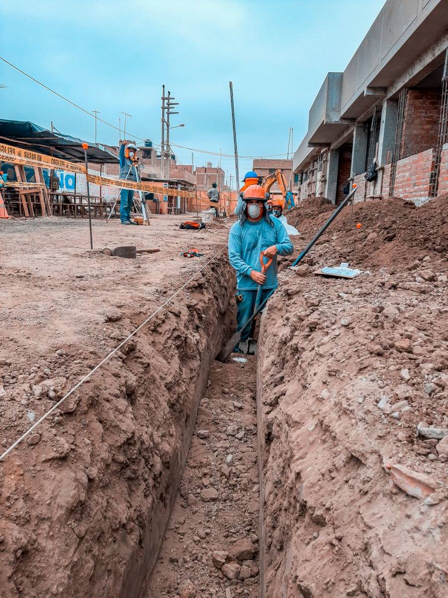 Crew opening a septic trench at a Clayton home site